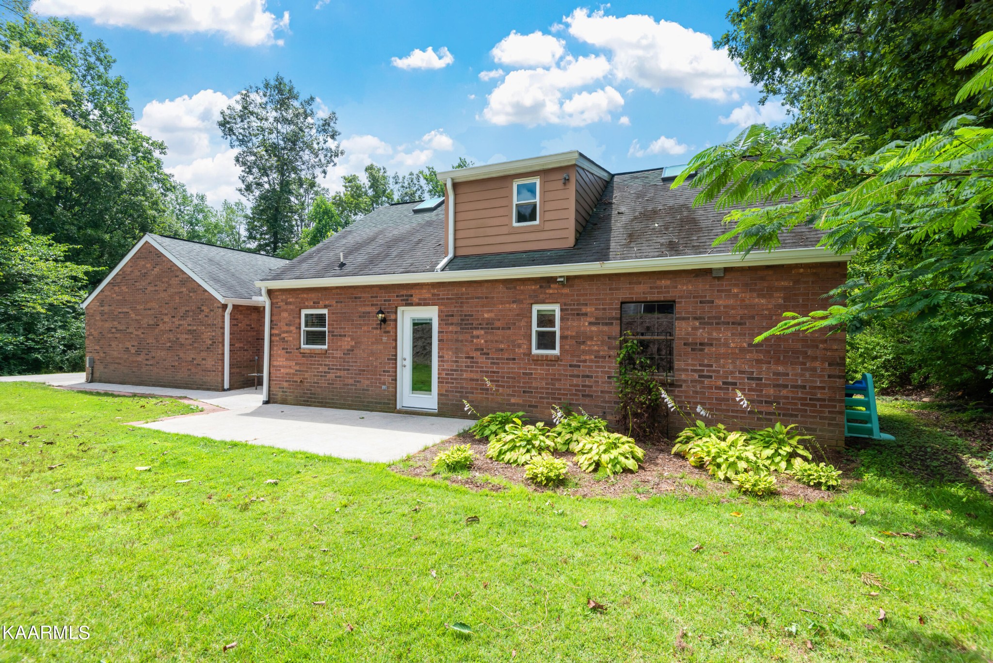 6034 Pleasant Ridge Road Knoxville, TN 37912 - Photo 31 of 40 a front view of a house with a yard and garage