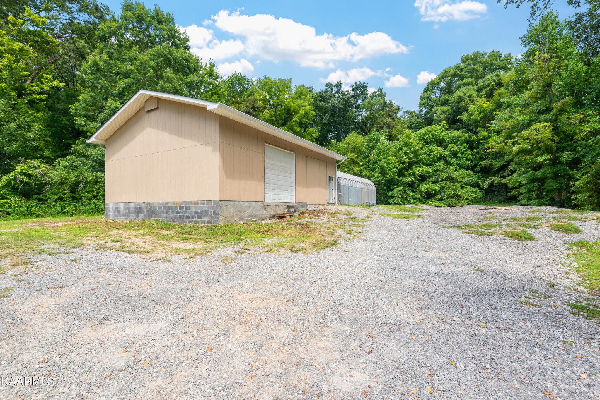 6034 Pleasant Ridge Road Knoxville, TN 37912 - Photo 35 of 40 a view of a house with backyard and trees