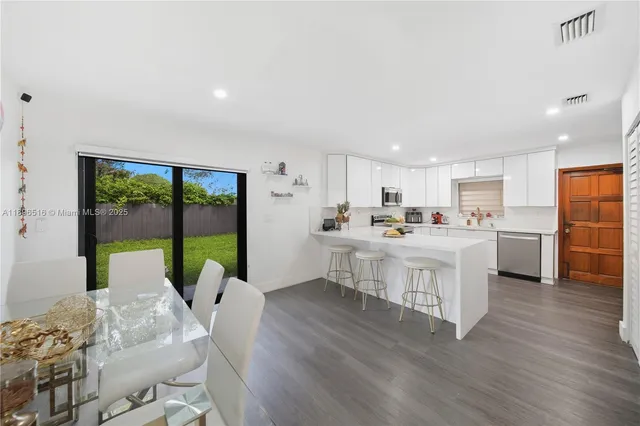 a view of a livingroom with furniture and a gate