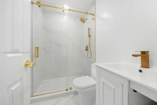 a bedroom with two beds and a painting on the wall