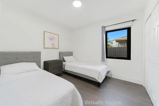 a living room with furniture mirror and window