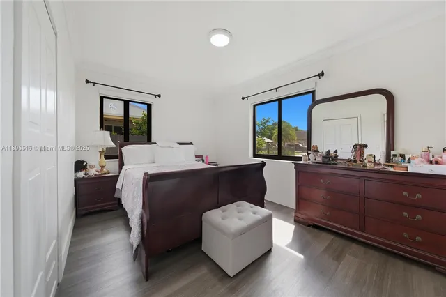 a bedroom with a bed and a chair