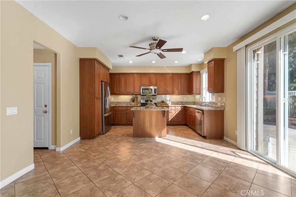 28817 Edenton Way Temecula, CA 92591 - Photo 20 of 56 a view of a kitchen with refrigerator and cabinets