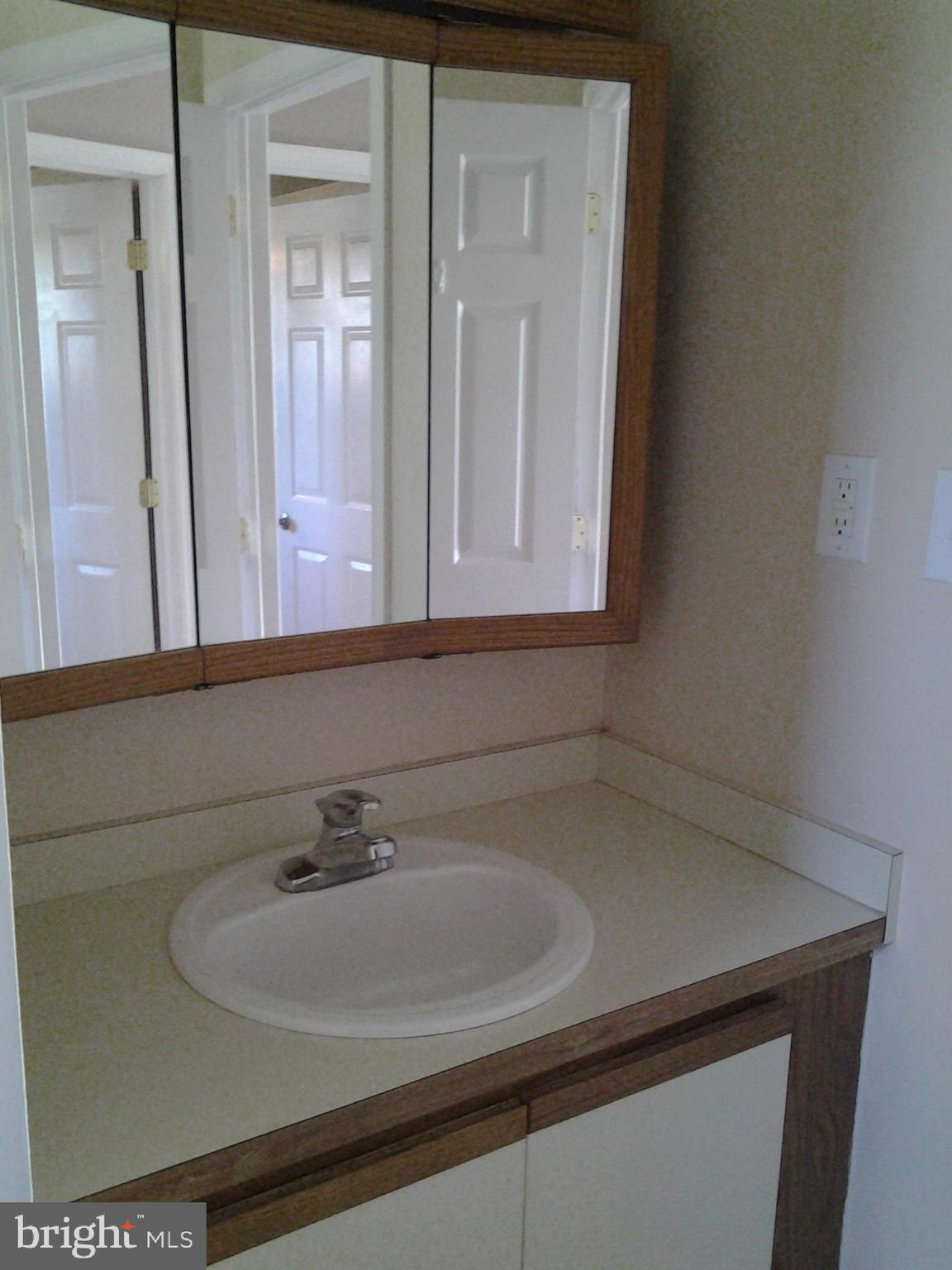 37 Eaves Mill Road Medford, NJ 08055 - Photo 11 of 14 a bathroom with a sink and a mirror