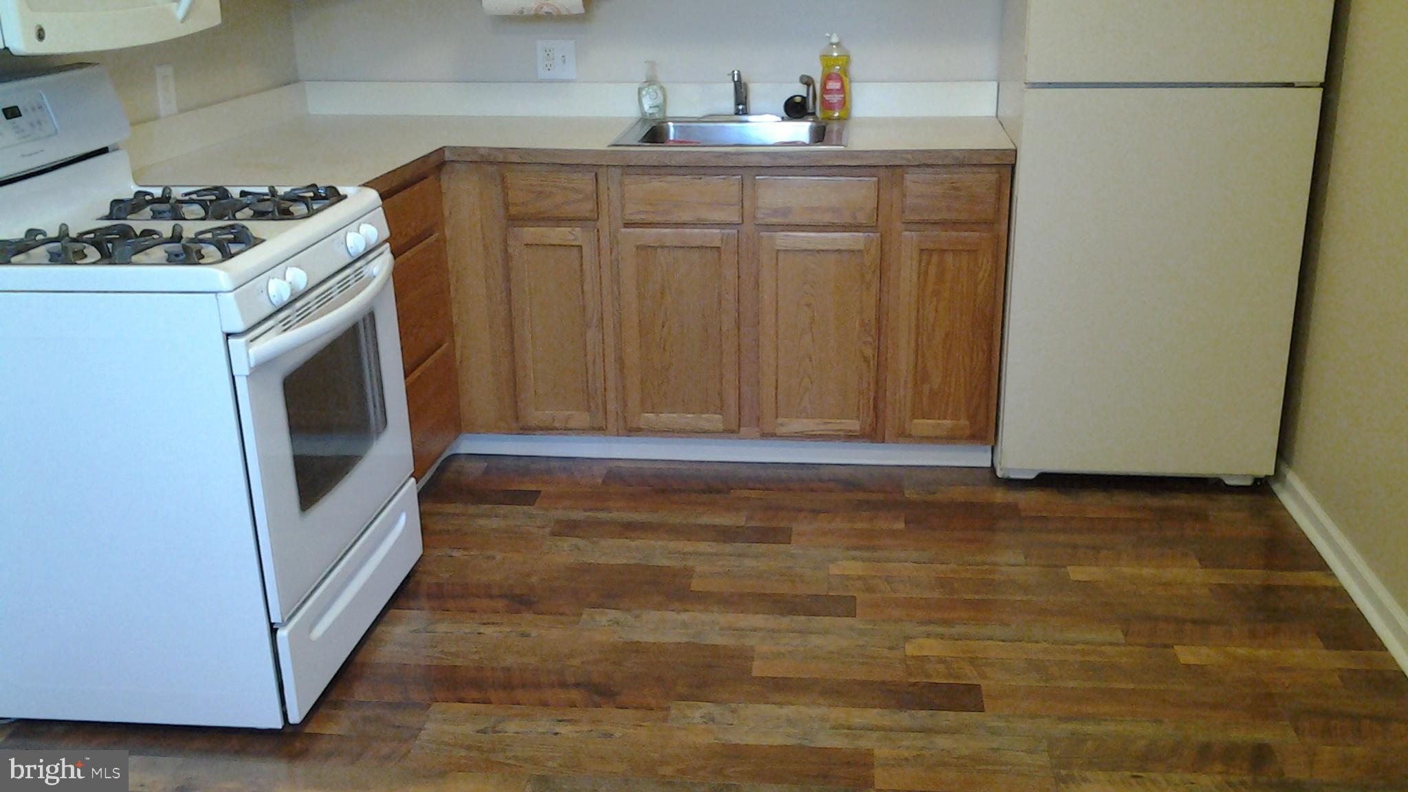 37 Eaves Mill Road Medford, NJ 08055 - Photo 4 of 14 a kitchen with granite countertop a sink and a stove
