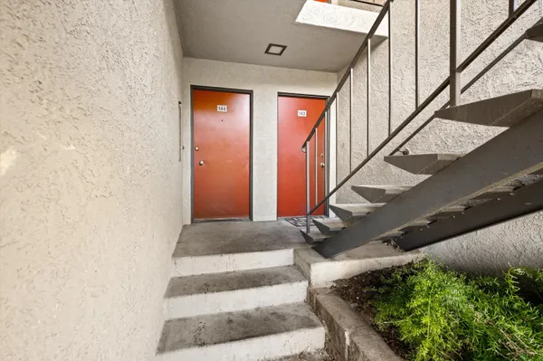 a view of balcony with furniture