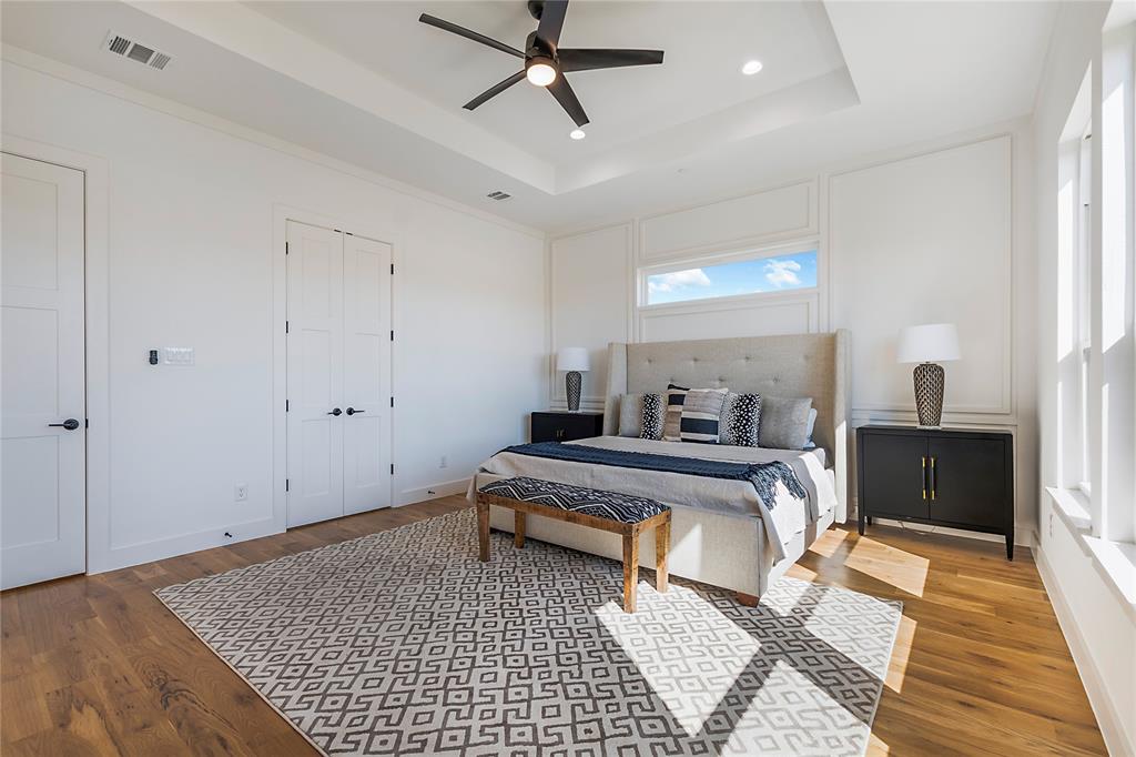 430 Whispering Way Red Oak, TX 75154 - Photo 36 of 40 Spacious room featuring wood-finish flooring and a tray ceiling with recessed lighting
