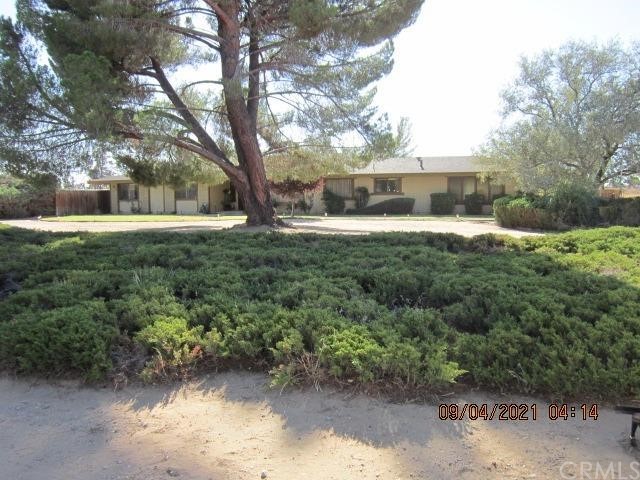 13870 Seminole Road Apple Valley, CA 92307 - Photo 1 of 1 a view of a yard with plants and trees