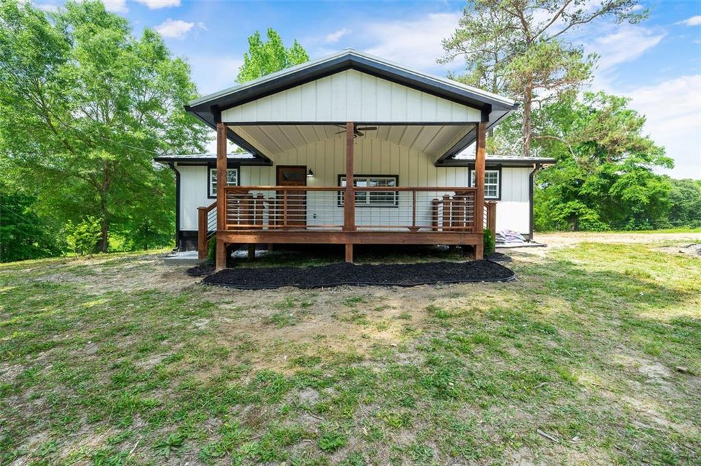 180 Sorrells Road Rockmart, GA 30153 - Photo 1 of 1 a view of a house with a yard plants and large tree