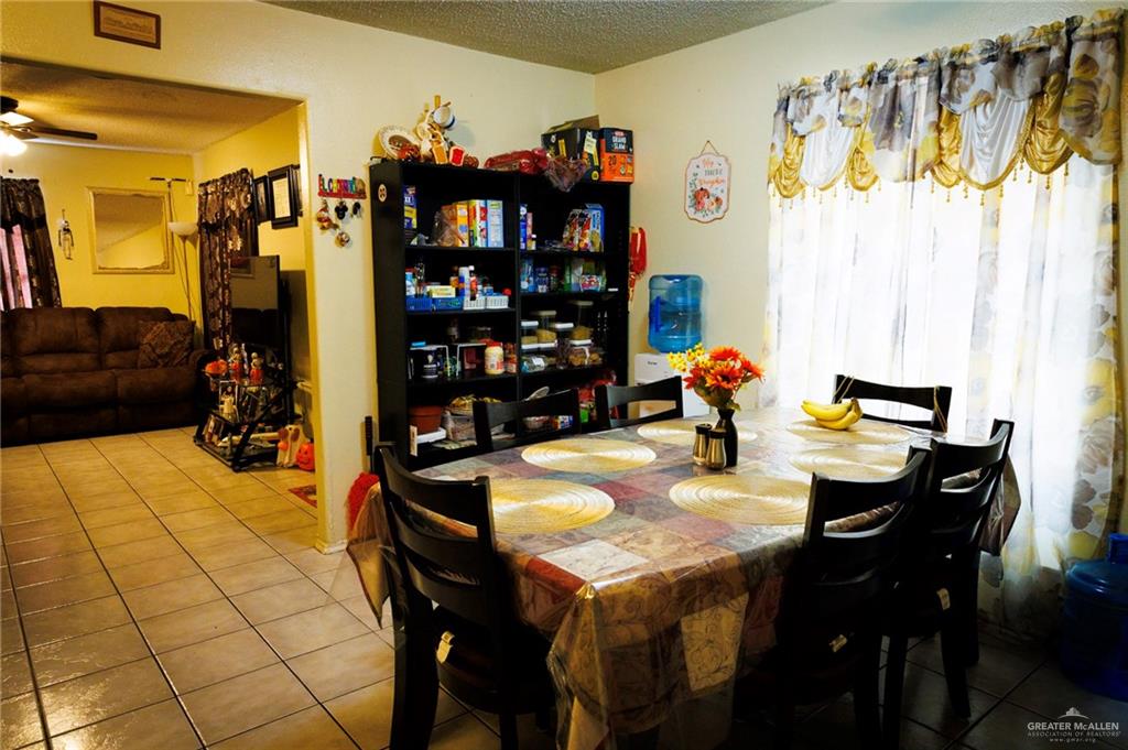 808 West Starr Avenue Pharr, TX 78577 - Photo 4 of 18 Dining room with tile patterned floors and a textured ceiling