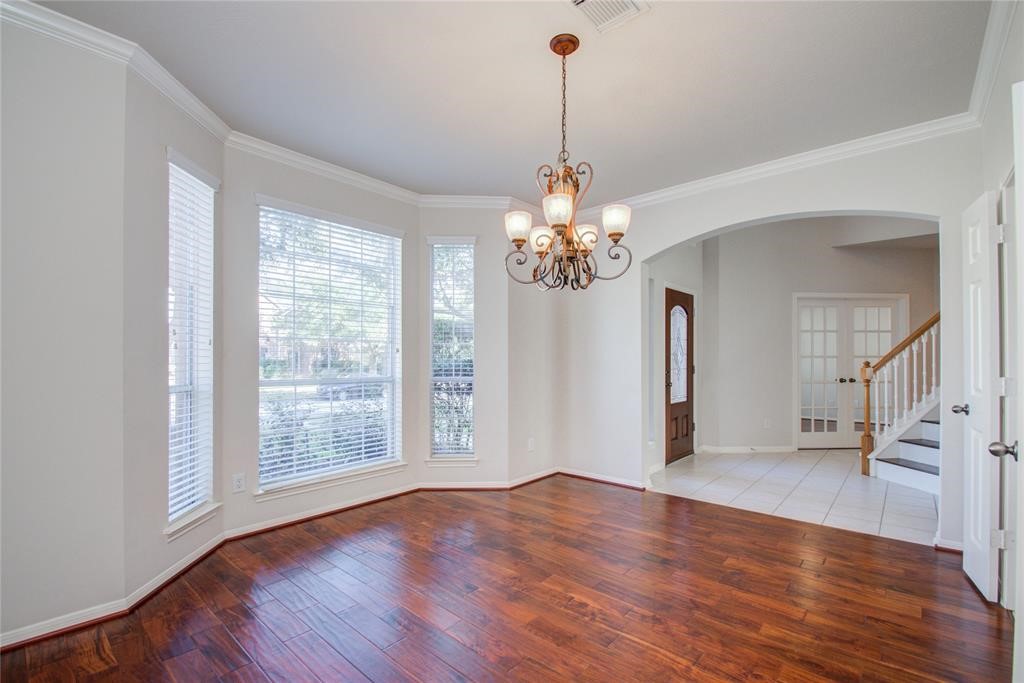 20011 Glen Lake Drive Spring, TX 77388 - Photo 11 of 31 a view of a livingroom with wooden floor and a chandelier