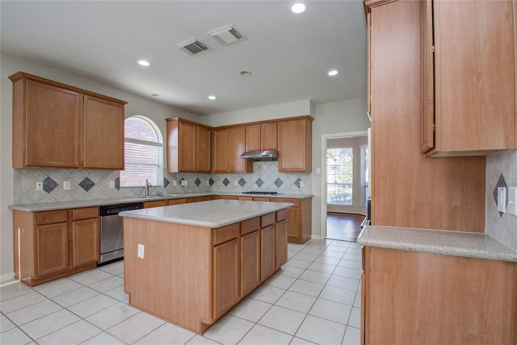 20011 Glen Lake Drive Spring, TX 77388 - Photo 12 of 31 a large kitchen with stainless steel appliances granite countertop a stove a sink and a microwave