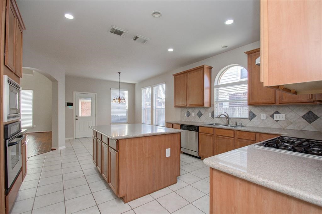 20011 Glen Lake Drive Spring, TX 77388 - Photo 13 of 31 a kitchen with stainless steel appliances granite countertop a sink and a stove