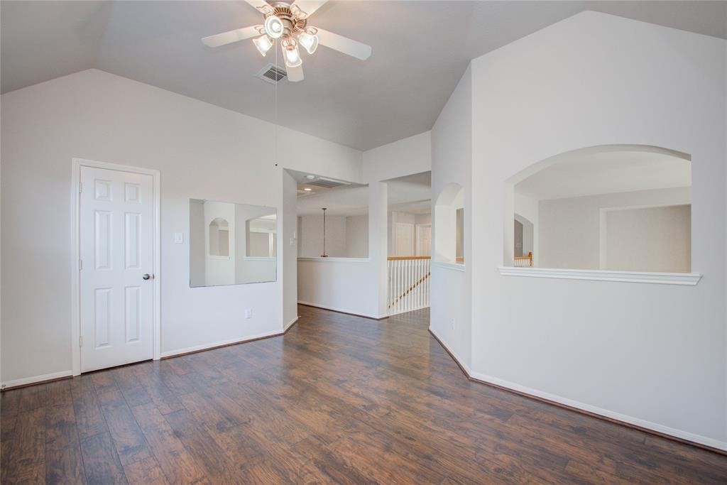 20011 Glen Lake Drive Spring, TX 77388 - Photo 17 of 31 a view of a livingroom with wooden floor and a ceiling fan