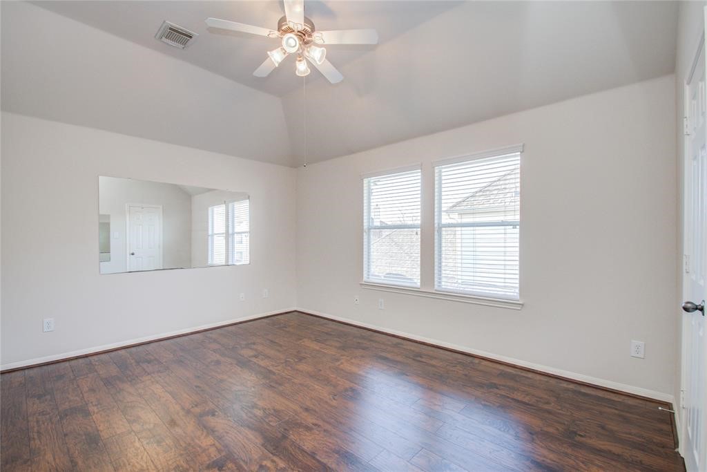 20011 Glen Lake Drive Spring, TX 77388 - Photo 18 of 31 a view of an empty room with wooden floor and a window