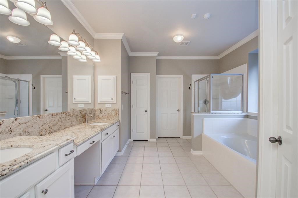 20011 Glen Lake Drive Spring, TX 77388 - Photo 24 of 31 a spacious bathroom with a granite countertop sink a mirror and a bathtub