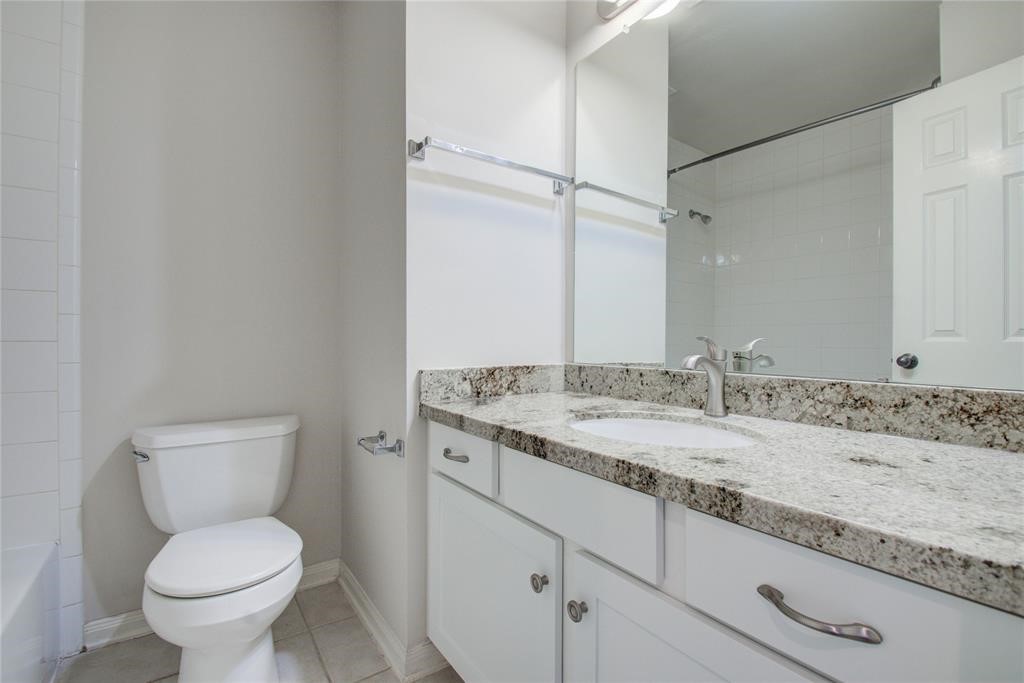 20011 Glen Lake Drive Spring, TX 77388 - Photo 27 of 31 a bathroom with a granite countertop toilet sink and mirror