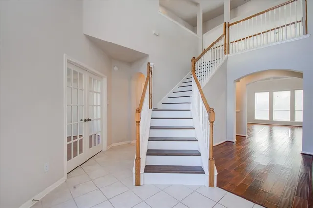 a large kitchen with stainless steel appliances granite countertop a stove a sink and a microwave