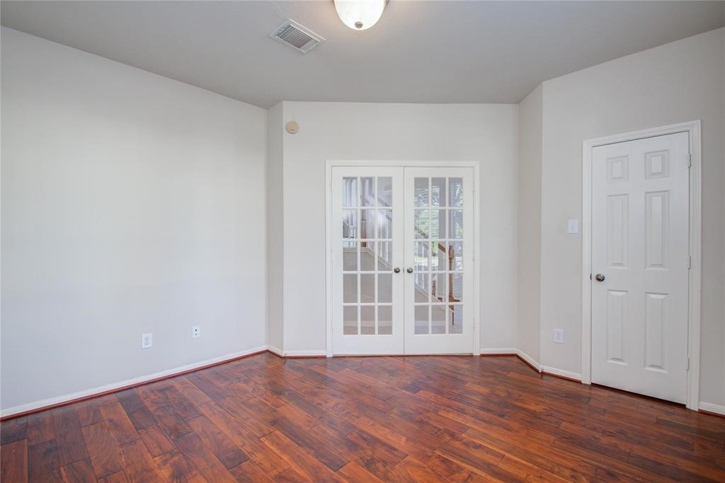 20011 Glen Lake Drive Spring, TX 77388 - Photo 10 of 31 a view of an empty room with wooden floor and a window
