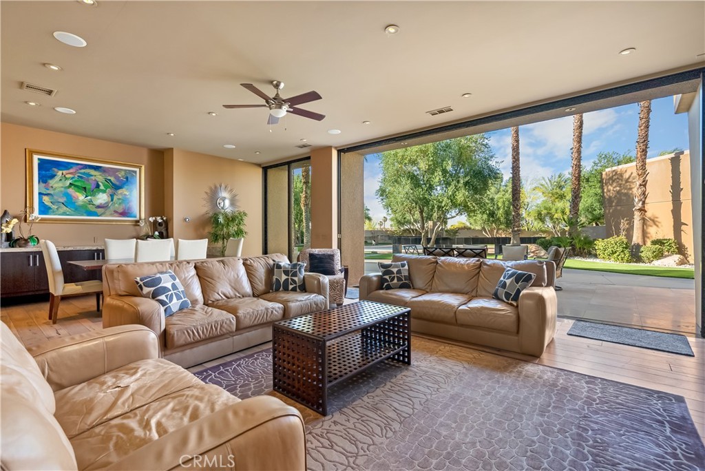 68 Royal St Georges Way Rancho Mirage, CA 92270 - Photo 37 of 75 a living room with furniture and a large window
