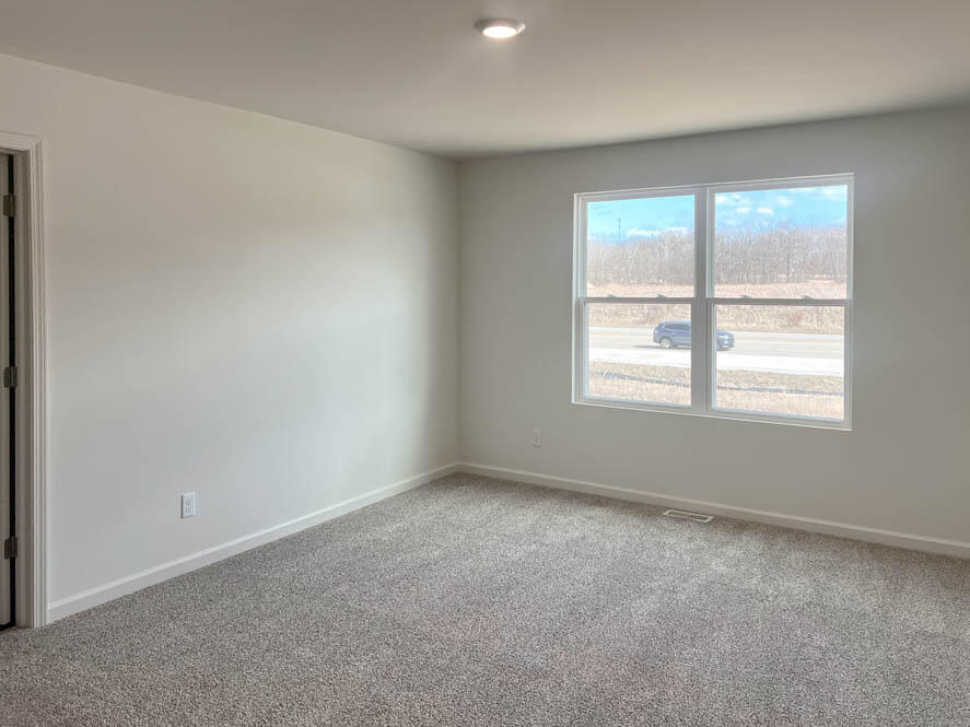 7110 Fair Oaks Road Mount Pleasant, WI 53403 - Photo 4 of 40 Upstairs primary bedroom with connecting en suite