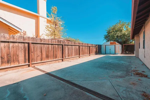 a view of backyard with green space