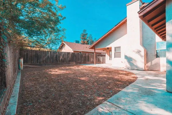 a backyard of a house with seating space