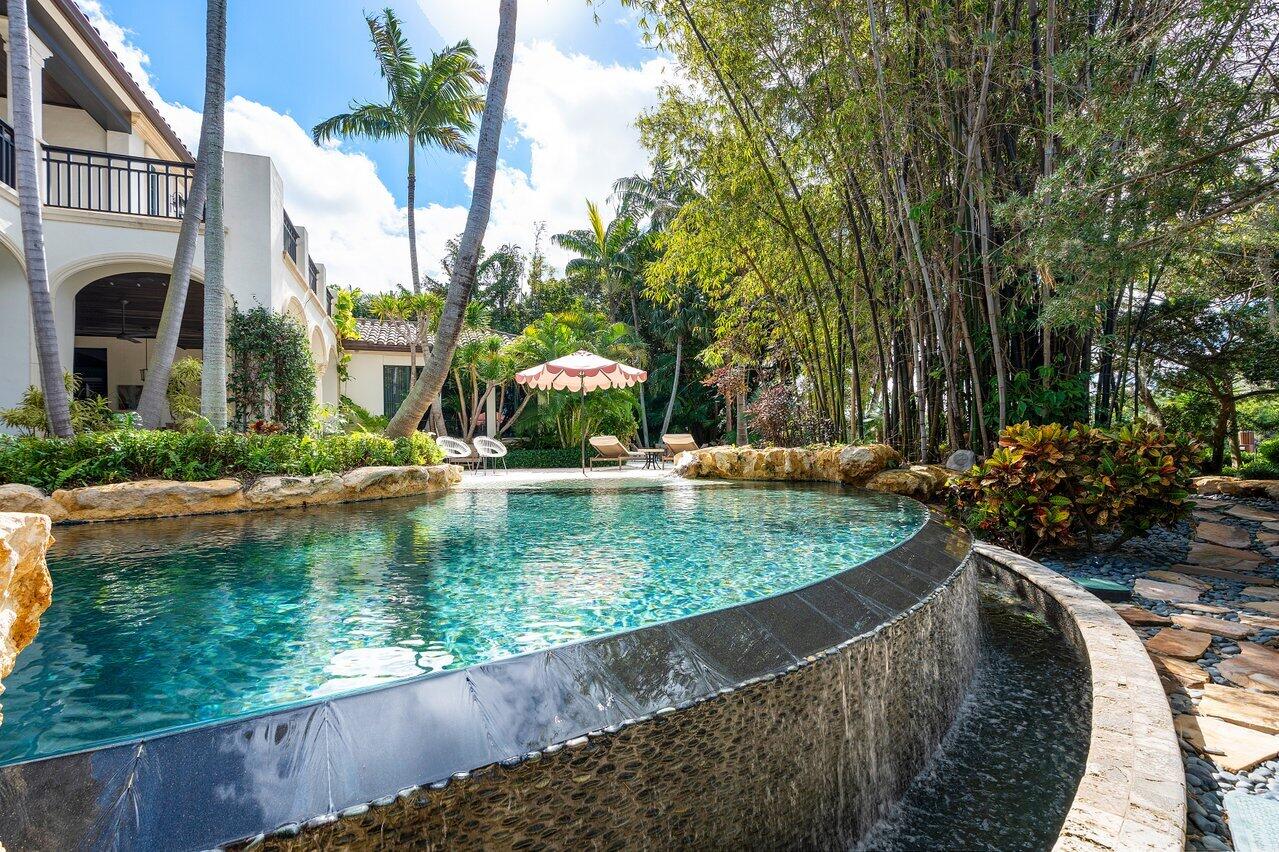 8 Driftwood Landing Road Gulf Stream, FL 33483 - Photo 19 of 67 a view of a swimming pool with a patio