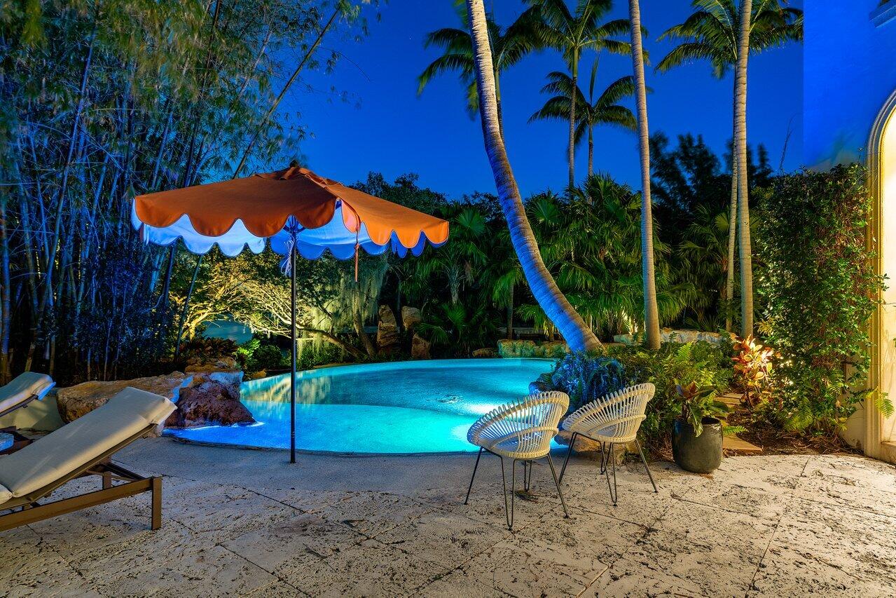 8 Driftwood Landing Road Gulf Stream, FL 33483 - Photo 21 of 67 a view of a backyard with plants and outdoor seating