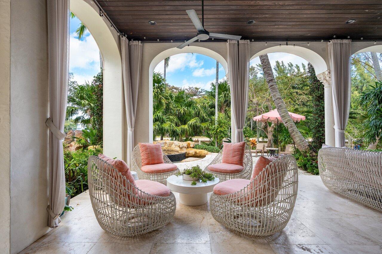 8 Driftwood Landing Road Gulf Stream, FL 33483 - Photo 28 of 67 a living room with furniture and garden view