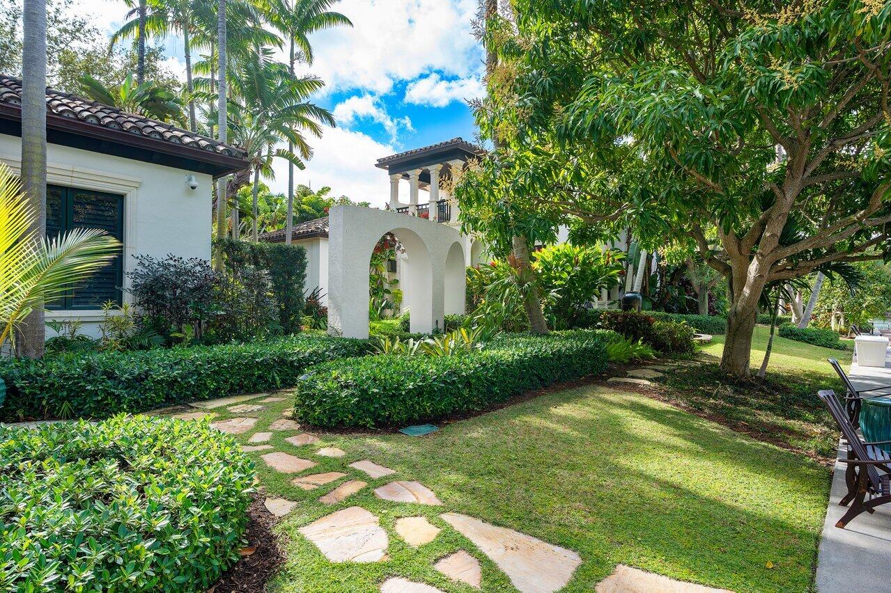 8 Driftwood Landing Road Gulf Stream, FL 33483 - Photo 29 of 67 a front view of a house with a yard