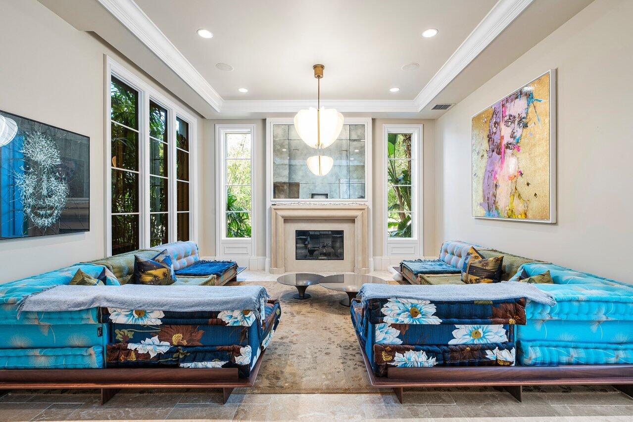 8 Driftwood Landing Road Gulf Stream, FL 33483 - Photo 32 of 67 a living room with fireplace furniture and a large window