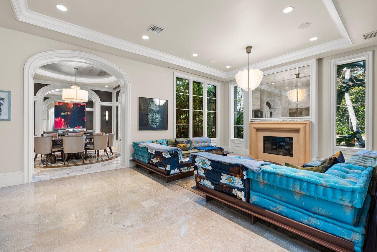 8 Driftwood Landing Road Gulf Stream, FL 33483 - Photo 33 of 67 a living room with furniture large window and a fireplace