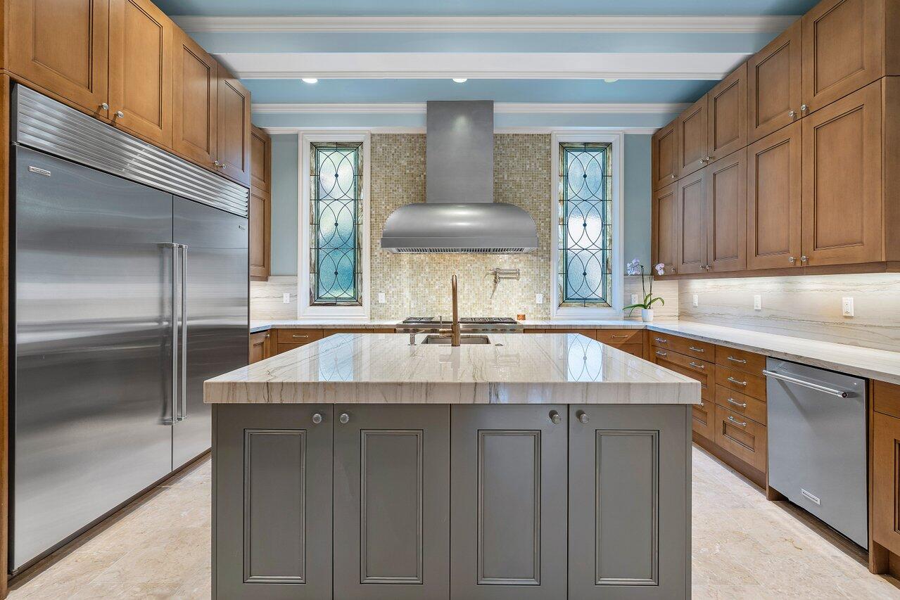 8 Driftwood Landing Road Gulf Stream, FL 33483 - Photo 37 of 67 a kitchen with a sink and cabinets