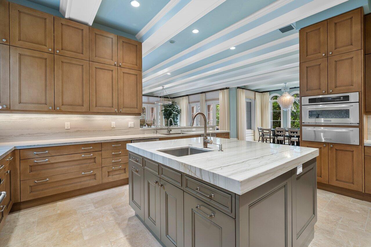 8 Driftwood Landing Road Gulf Stream, FL 33483 - Photo 38 of 67 a kitchen with granite countertop a sink and dishwasher