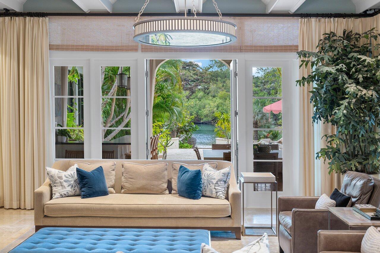 8 Driftwood Landing Road Gulf Stream, FL 33483 - Photo 39 of 67 a living room with furniture and a large window