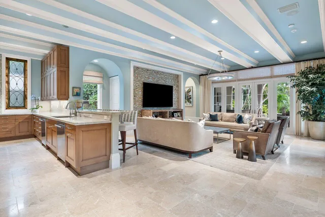 a living room with furniture ceiling fan and a window