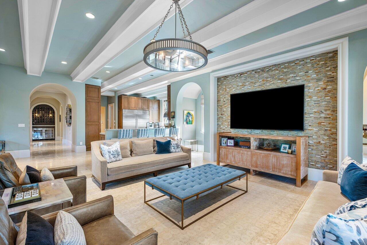 8 Driftwood Landing Road Gulf Stream, FL 33483 - Photo 43 of 67 a living room with furniture a flat screen tv and a fireplace