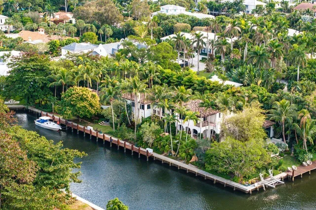 a view of a swimming pool with a yard