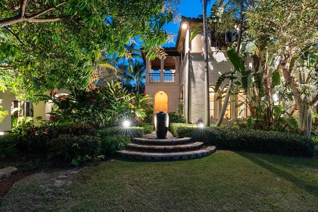 a view of swimming pool with a yard and plants