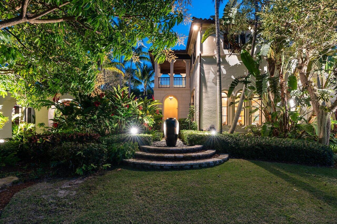 8 Driftwood Landing Road Gulf Stream, FL 33483 - Photo 10 of 67 a front view of a house with garden