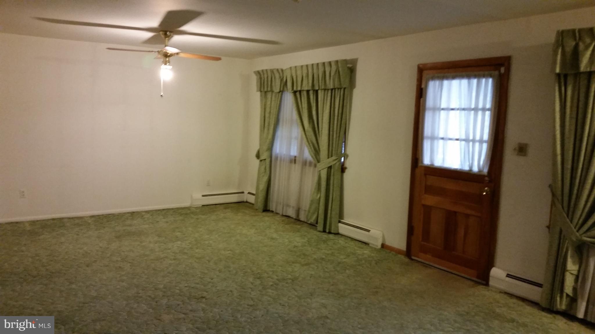 8734 Edmonston Road Berwyn Heights, MD 20740 - Photo 11 of 13 an empty room with windows and closet
