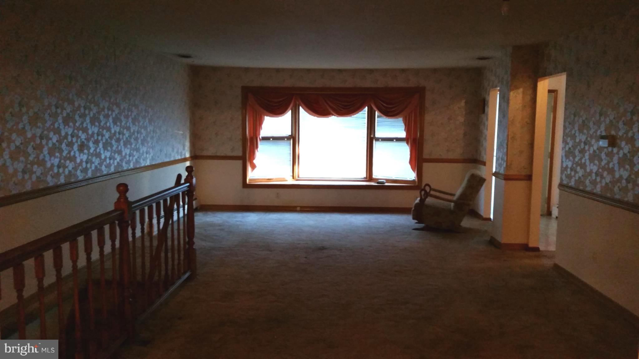 8734 Edmonston Road Berwyn Heights, MD 20740 - Photo 6 of 13 a view of empty room with a window