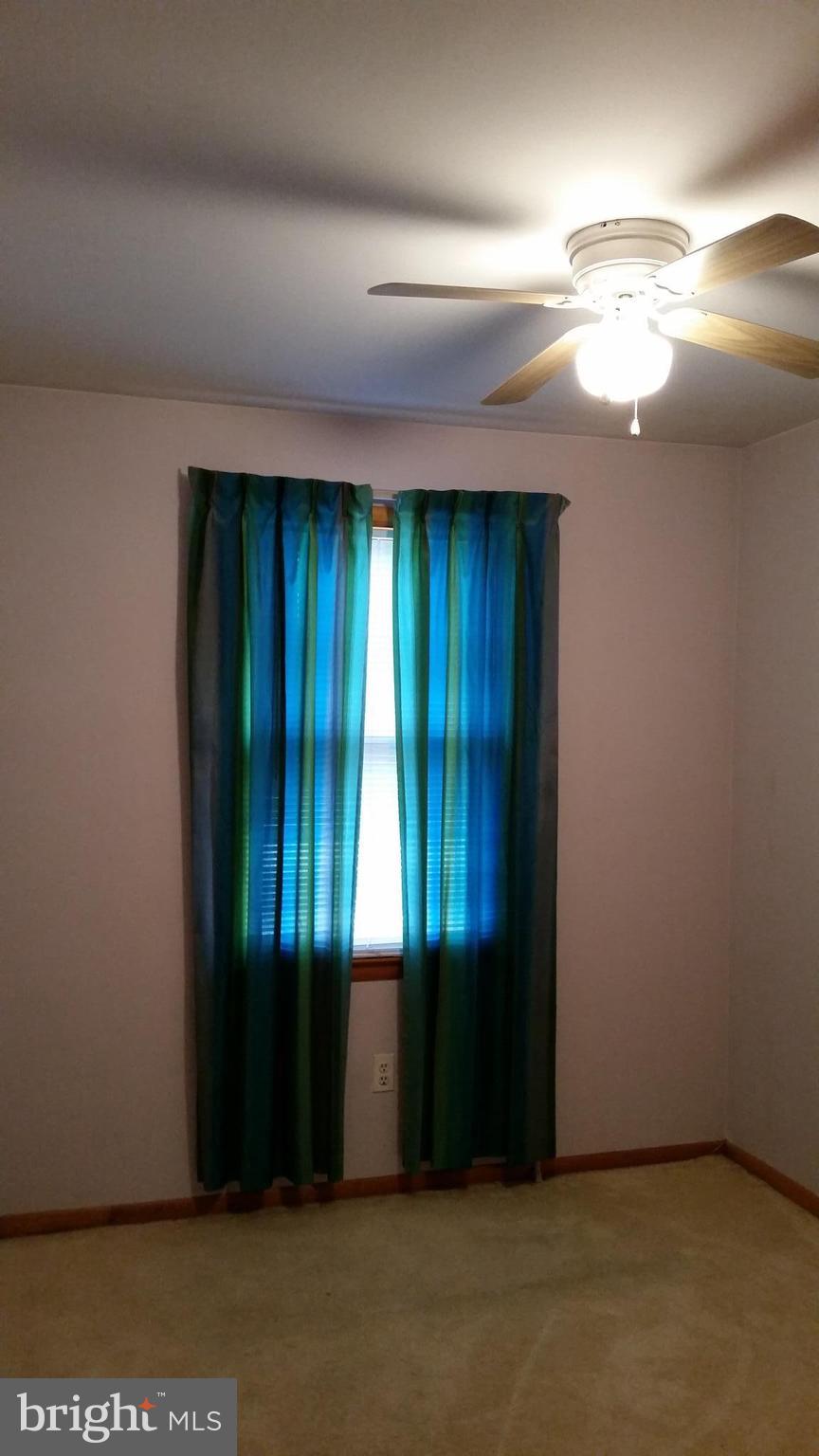 8734 Edmonston Road Berwyn Heights, MD 20740 - Photo 9 of 13 a view of an empty room with a window