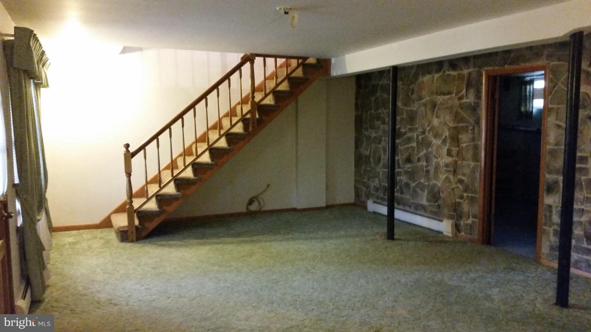 8734 Edmonston Road Berwyn Heights, MD 20740 - Photo 10 of 13 a view of an empty room with stairs