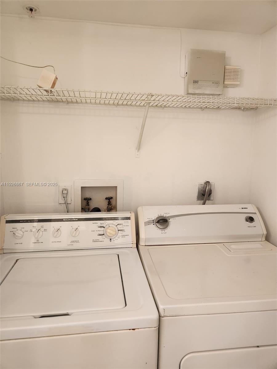 12124 St Andrews Place, Unit 206 Miramar, FL 33025 - Photo 12 of 20 a utility room with dryer and washer