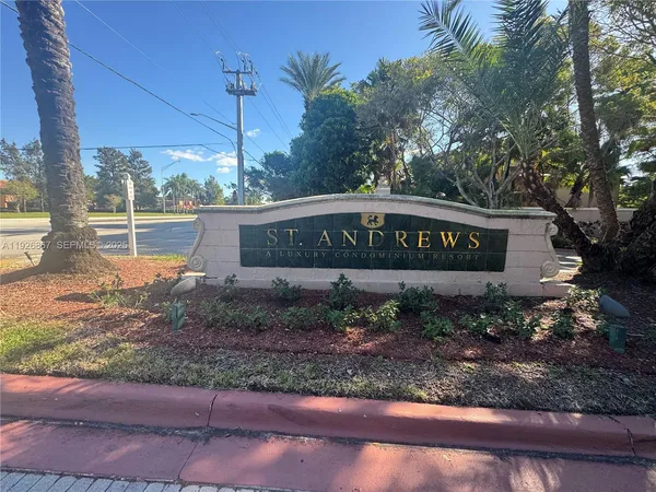 a front view of a house with yard and green space