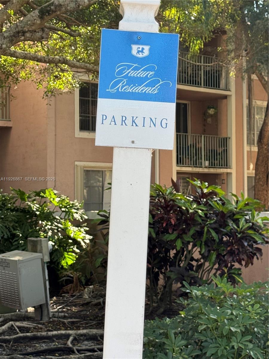 12124 St Andrews Place, Unit 206 Miramar, FL 33025 - Photo 17 of 20 a sign that is sitting in front of flowers