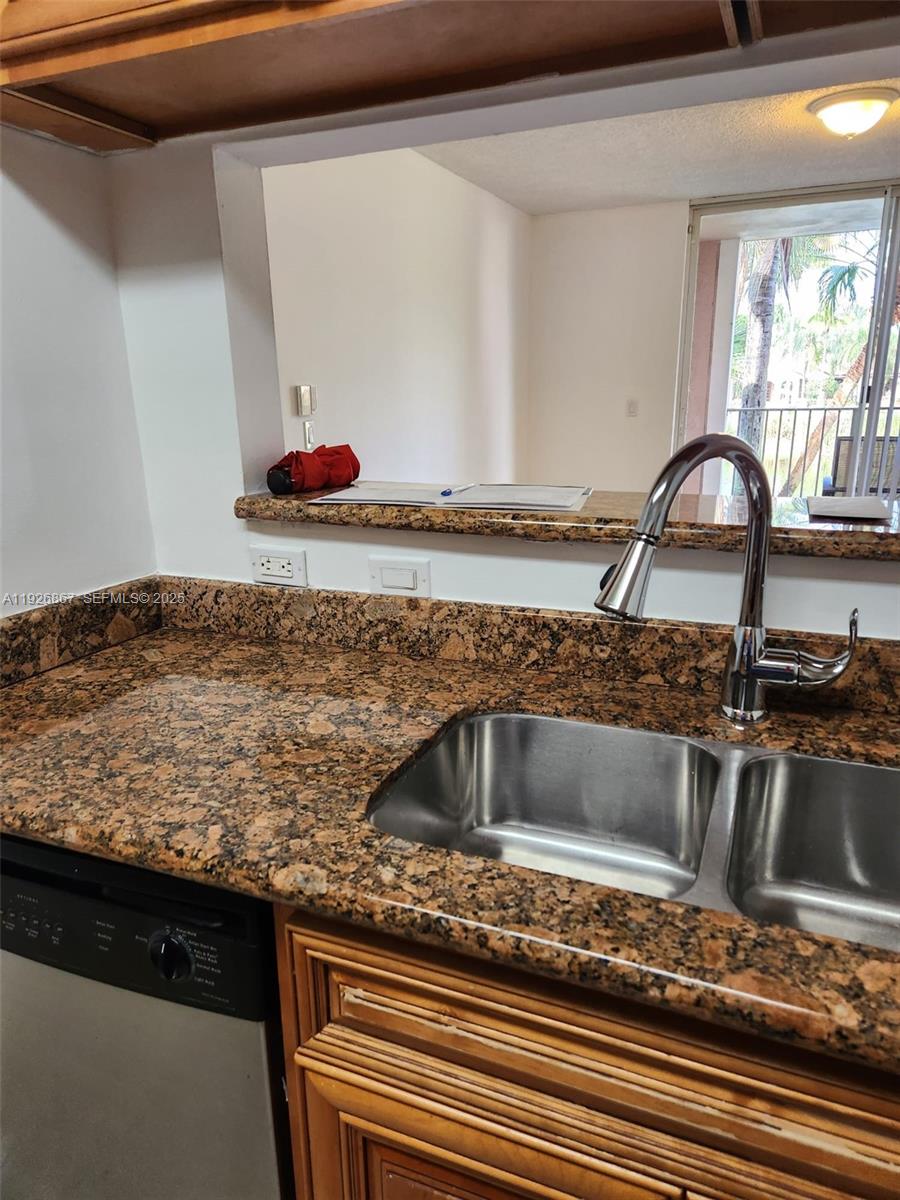 12124 St Andrews Place, Unit 206 Miramar, FL 33025 - Photo 6 of 20 a kitchen with sink and window