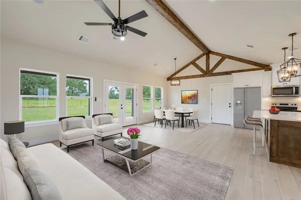 a living room with furniture and a large window